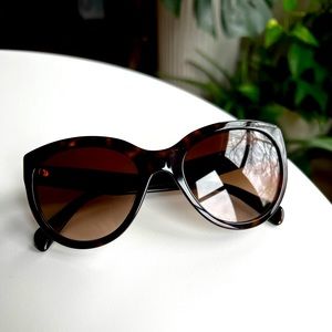 Prada cat eye tortoise with brown lense sunglasses.